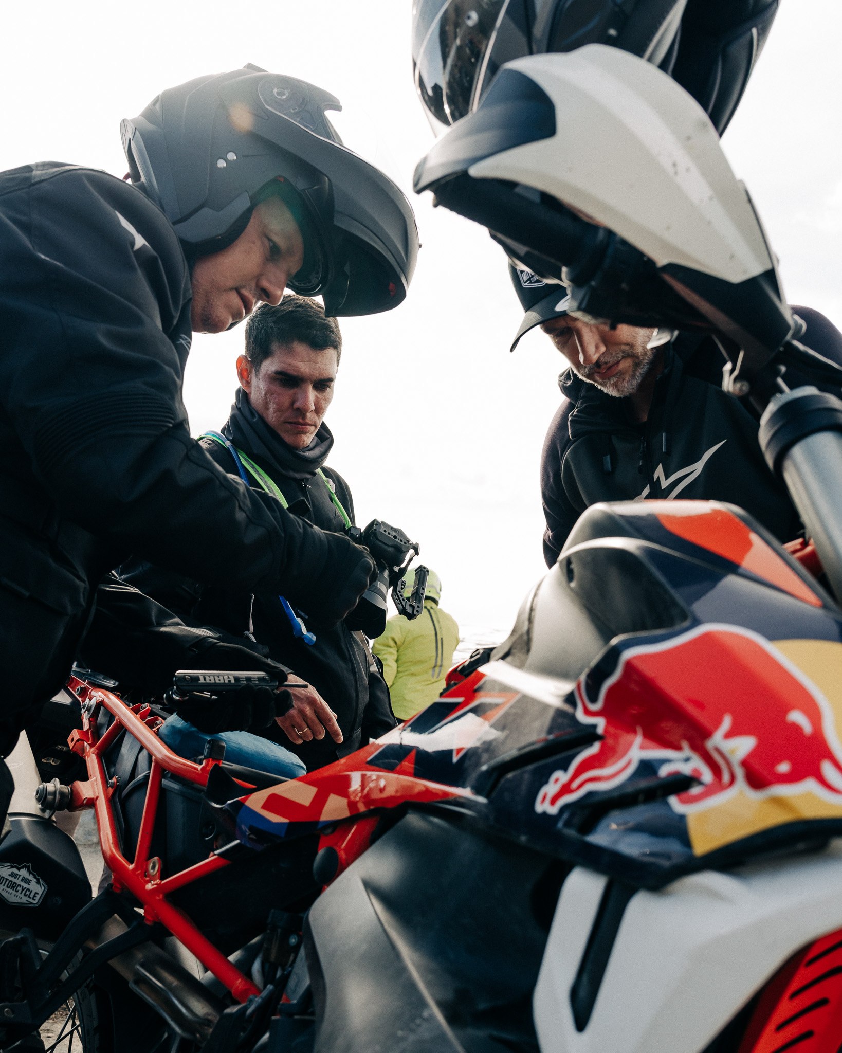 Crew checking over a motorcycle before a ride
